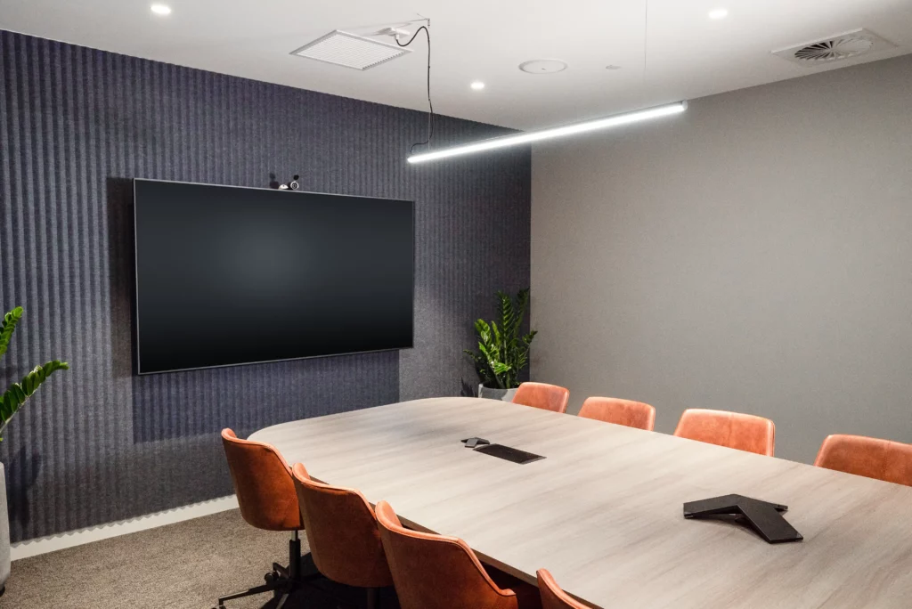 The 'Yarra Boardroom', a Stylish 12 Person Boardroom with HDMI Flat Panel Screen for Presentations For Hire at Waterman Richmond Coworking Space in Richmond, VIC